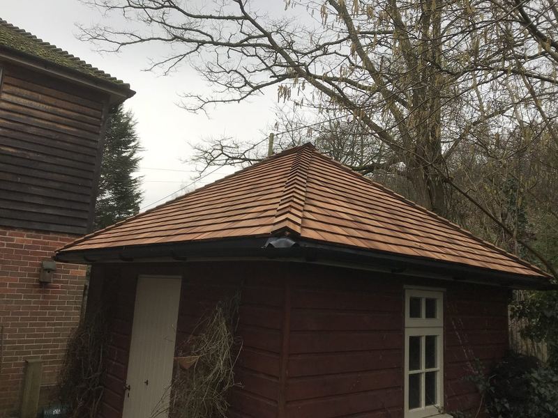 Open oak pavilion with a handmade clay tile roof